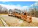 House with covered porch and deck, offering wooded views at 3264 W Roberts Rd, Trafalgar, IN 46181