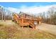 House with deck, stairs, and a gravel driveway at 3264 W Roberts Rd, Trafalgar, IN 46181
