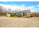 Ranch home with attached garage and deck, nestled in the woods at 3264 W Roberts Rd, Trafalgar, IN 46181