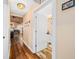 Bright hallway with hardwood floors and view into dining area at 3264 W Roberts Rd, Trafalgar, IN 46181