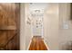 Bright hallway with wood floors and a rustic barn door at 3264 W Roberts Rd, Trafalgar, IN 46181