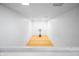 Indoor basketball court with white walls and hardwood floor at 3264 W Roberts Rd, Trafalgar, IN 46181