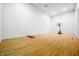 Indoor basketball court featuring hardwood floors and white walls at 3264 W Roberts Rd, Trafalgar, IN 46181