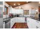 Modern kitchen with white cabinets, granite countertops and a breakfast bar at 3264 W Roberts Rd, Trafalgar, IN 46181