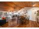 Open floor plan showing kitchen with island, white cabinets, and wood floors at 3264 W Roberts Rd, Trafalgar, IN 46181