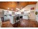 Modern kitchen with white cabinets, granite countertops, and an island at 3264 W Roberts Rd, Trafalgar, IN 46181