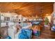 Open living space showcasing a cozy sofa, wood floors, and a stunning wood-paneled ceiling at 3264 W Roberts Rd, Trafalgar, IN 46181