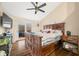 Large bedroom with a king-size bed, hardwood floors, and access to a private deck at 3264 W Roberts Rd, Trafalgar, IN 46181