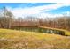 Tranquil pond surrounded by lush greenery, a perfect natural setting at 3264 W Roberts Rd, Trafalgar, IN 46181