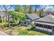 An aerial view showing the property with a yard and mature trees at 35 S Catherwood Ave, Indianapolis, IN 46219