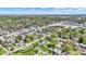 Overhead shot showcases a charming residential area with a mix of homes, businesses, and green spaces at 35 S Catherwood Ave, Indianapolis, IN 46219