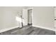 Simple bedroom with grey flooring and white wainscoting at 35 S Catherwood Ave, Indianapolis, IN 46219