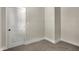 This bedroom has neutral carpet and walls with a white door and trim at 35 S Catherwood Ave, Indianapolis, IN 46219