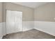 Comfortable bedroom with carpeting, wainscoting and a large closet at 35 S Catherwood Ave, Indianapolis, IN 46219