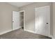 Bedroom with carpeting and two doorways; one to a closet at 35 S Catherwood Ave, Indianapolis, IN 46219