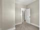 Bright bedroom with neutral carpet and walls with white doors at 35 S Catherwood Ave, Indianapolis, IN 46219