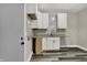 Kitchen features granite countertops, tile backsplash, modern cabinets, and vinyl flooring at 35 S Catherwood Ave, Indianapolis, IN 46219