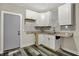 Well-lit kitchen showcasing new cabinets, granite countertops and modern tile backsplash at 35 S Catherwood Ave, Indianapolis, IN 46219