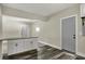 Kitchen island boasts storage space and granite countertops, complemented by modern flooring at 35 S Catherwood Ave, Indianapolis, IN 46219