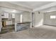 Inviting open-concept living room with kitchen featuring modern countertops and flooring at 35 S Catherwood Ave, Indianapolis, IN 46219