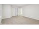 Spacious bedroom with neutral carpeting and double doors leading to another room at 3921 Wren Dr, Brownsburg, IN 46112