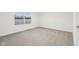 Bright bedroom with neutral carpeting and window at 3921 Wren Dr, Brownsburg, IN 46112