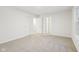 Spacious bedroom with neutral carpeting and access to other rooms at 3921 Wren Dr, Brownsburg, IN 46112