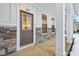 Modern front door with stone accents and a covered porch at 3921 Wren Dr, Brownsburg, IN 46112