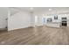 Open concept kitchen with white cabinets, island, and stainless steel appliances at 3921 Wren Dr, Brownsburg, IN 46112
