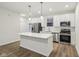 Modern kitchen with stainless steel appliances and an island at 3921 Wren Dr, Brownsburg, IN 46112
