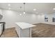 Modern kitchen with white cabinets and island, stainless steel appliances at 3921 Wren Dr, Brownsburg, IN 46112