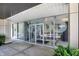 Glass doors entrance to building with modern signage at 3965 N Meridian St # Apt 6C, Indianapolis, IN 46208