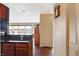 Bright hallway with wood flooring and access to kitchen and living areas at 3965 N Meridian St # Apt 6C, Indianapolis, IN 46208