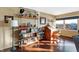 Charming home office with built-in shelving, hardwood floors, and a vintage desk at 3965 N Meridian St # Apt 6C, Indianapolis, IN 46208