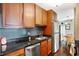 Well-equipped kitchen with dark granite counters at 3965 N Meridian St # Apt 6C, Indianapolis, IN 46208