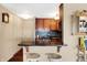 Kitchen with granite countertop and wooden cabinets at 3965 N Meridian St # Apt 6C, Indianapolis, IN 46208
