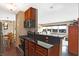 Kitchen boasts granite counters, stainless steel appliances, and wood cabinets at 3965 N Meridian St # Apt 6C, Indianapolis, IN 46208