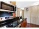 Modern kitchen features stainless steel appliances and granite countertops at 3965 N Meridian St # Apt 6C, Indianapolis, IN 46208
