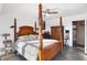 Main bedroom with a four-poster bed, dresser, and ceiling fan at 3965 N Meridian St # Apt 6C, Indianapolis, IN 46208