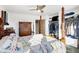 Main bedroom with large closet, four-poster bed, and ceiling fan at 3965 N Meridian St # Apt 6C, Indianapolis, IN 46208