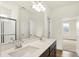 Elegant bathroom with a double vanity, large mirror, and ample lighting fixtures at 4103 Railhead Ave, Westfield, IN 46074