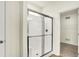 Modern bathroom with glass shower door and view of walk-in closet at 4103 Railhead Ave, Westfield, IN 46074