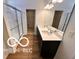 Bathroom with double vanity, quartz countertop and glass shower at 4103 Railhead Ave, Westfield, IN 46074