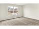 Bedroom with a large window providing natural light and views of the outdoors, complemented by neutral walls and carpet at 4103 Railhead Ave, Westfield, IN 46074