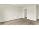 Clean bedroom features neutral carpet, off-white walls and a doorway to a walk-in closet, maximizing space at 4103 Railhead Ave, Westfield, IN 46074