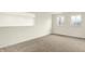 Versatile bonus room featuring two windows, neutral carpet, and ample natural light, ideal for an office or play area at 4103 Railhead Ave, Westfield, IN 46074
