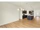 Open dining room area with hardwood floors, chandelier and a view of the kitchen at 4103 Railhead Ave, Westfield, IN 46074