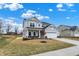 Beautiful exterior view of home with a two-car garage, landscaping, and a well-manicured lawn at 4103 Railhead Ave, Westfield, IN 46074