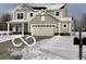 Two-story house with gray siding, white trim, and a three-car garage at 4103 Railhead Ave, Westfield, IN 46074