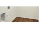 Efficient laundry area with wood-look flooring, connections for appliances, and neutral-toned walls for a clean design at 4103 Railhead Ave, Westfield, IN 46074